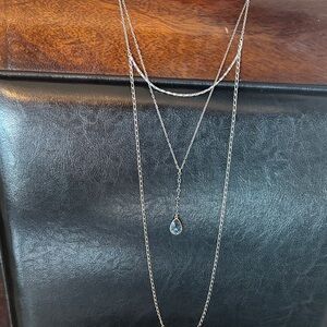 Touchstone layered silver necklace with blue drop. Swavorski crystal